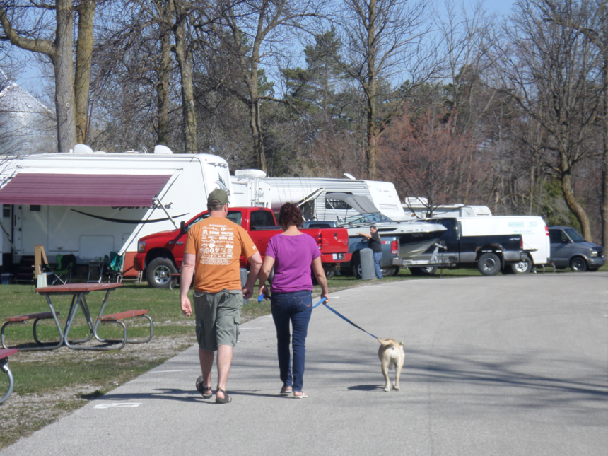 Campers walking dog
